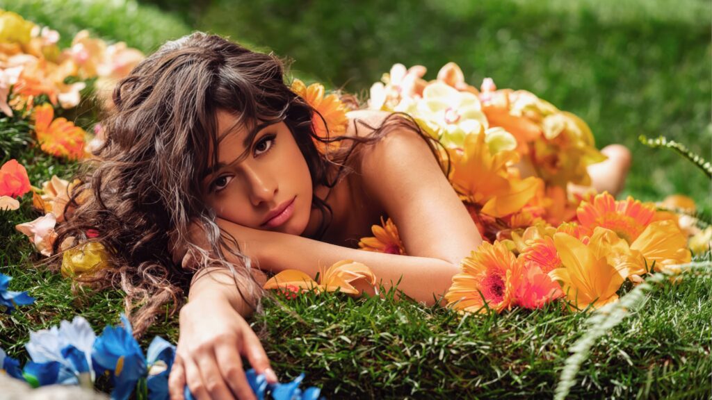 Singer Camila Cabello With Flowers 4k Wallpaper Background